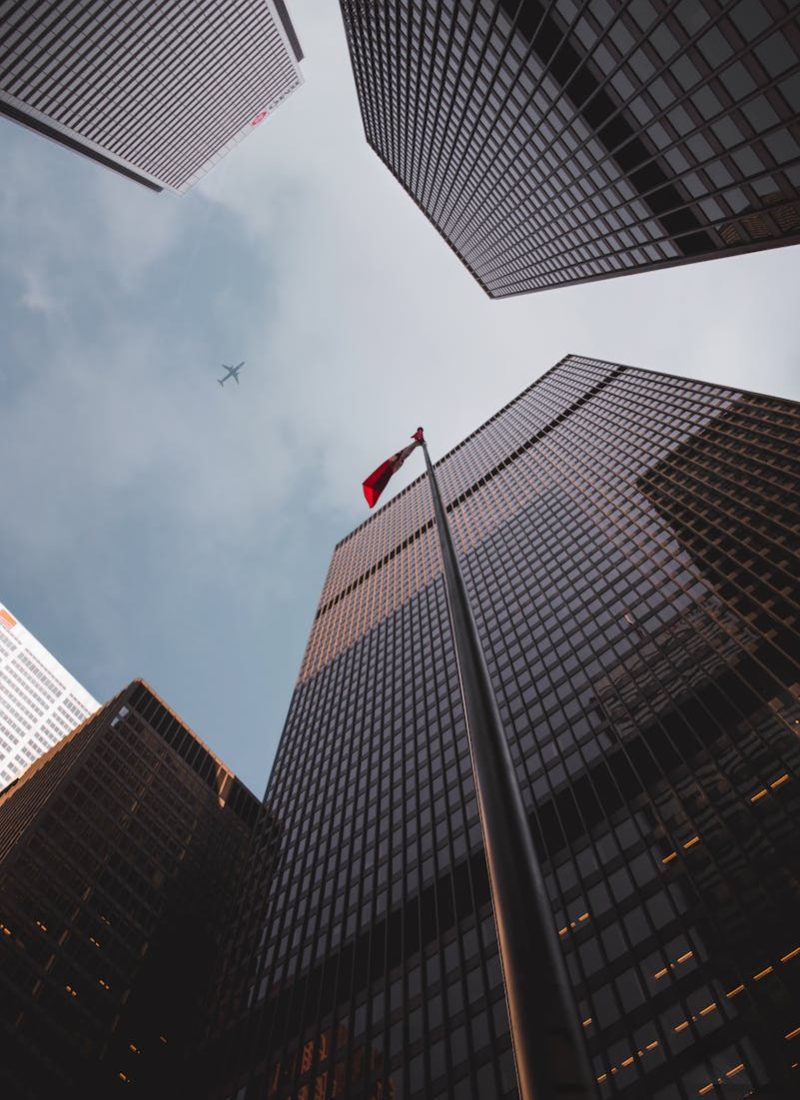 Photo by Mario Cuadros Low Angle Photography Of Tall Building Buildings